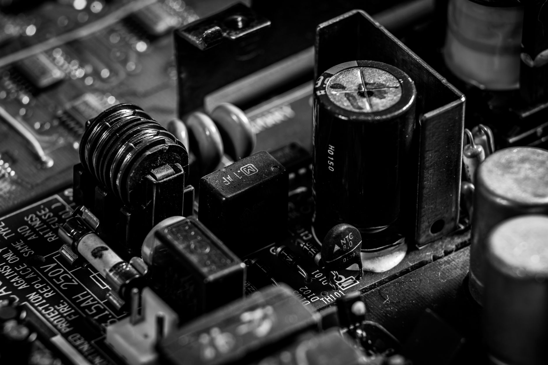Camera bodies and lenses on a dark surface